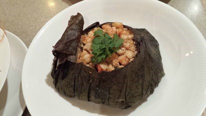 Braised ''Ee Fu Noodles'' with Diced Seafood, Mushrooms and Yellow Chives wrapped in Lotus Leaf