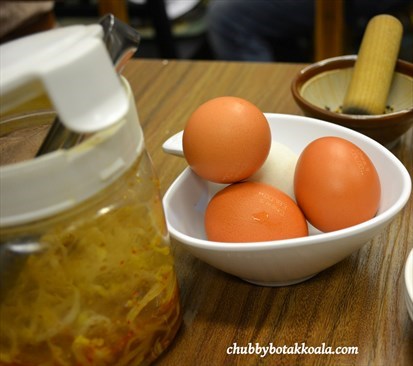 Free Side Dish - Boiled Eggs and Pickled Bean Sprout.